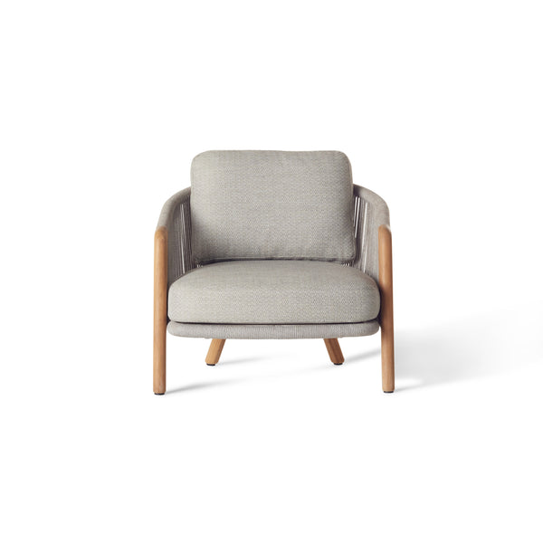 Avila Lounge Chair by Terra Outdoor Living — features a sculptural frame with premium teak legs, wraparound sides and back crafted from durable all-weather rope over powdercoated aluminum, paired with plush, low-profile cushions in a clean, modern silhouette made for outdoor lounging.