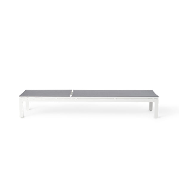 Belvedere Chaise by Terra Outdoor Living in White, featuring a sleek aluminum frames and silver-grey colored Textilene sling fabric that resists tears, retains shape, and dries quickly. This chaise reclines to 5 positions, including fully flat, with hidden wheels for easy maneuvering, offering comfort and durability for years of outdoor relaxation. 