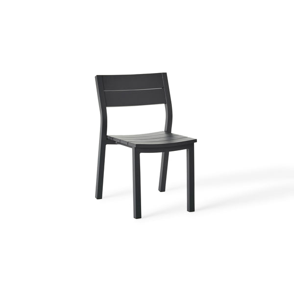 Belvedere Dining Side Chair in Charcoal by Terra Outdoor Living combines expertly crafted aluminum and durable finishes with a slightly scooped seat and flared back for enhanced comfort, plus a stackable design for easy, compact storage.