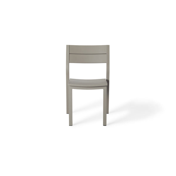 Belvedere Side Chair by Terra Outdoor Living, featuring a sleek aluminum frame in a 'Quartz Grey' finish - a warm grey tone - with a slightly scooped seat and flared back, shown in a modern, airy silhouette designed for comfort and easy stacking.