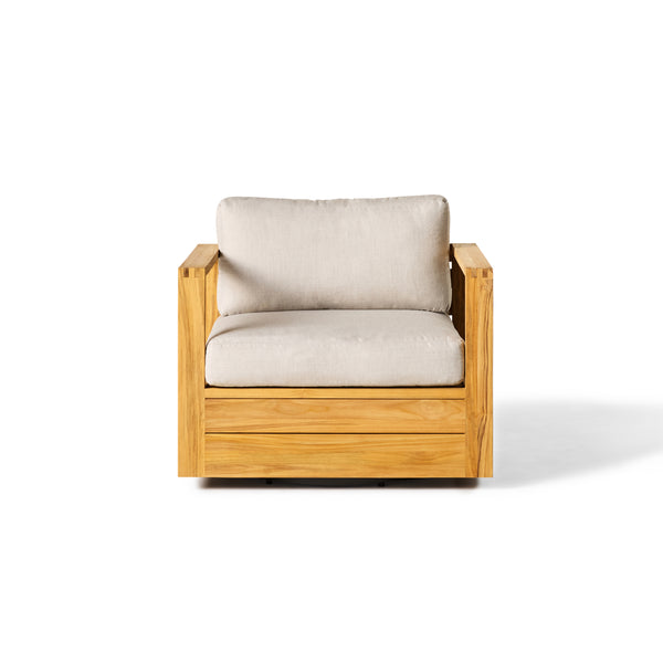 Belvedere Swivel Lounge Chair by Terra Outdoor Living, featuring a sustainably sourced solid teak frame, architectural silhouette, and thick outdoor friendly cushions atop a hidden 360° aluminum swivel base.