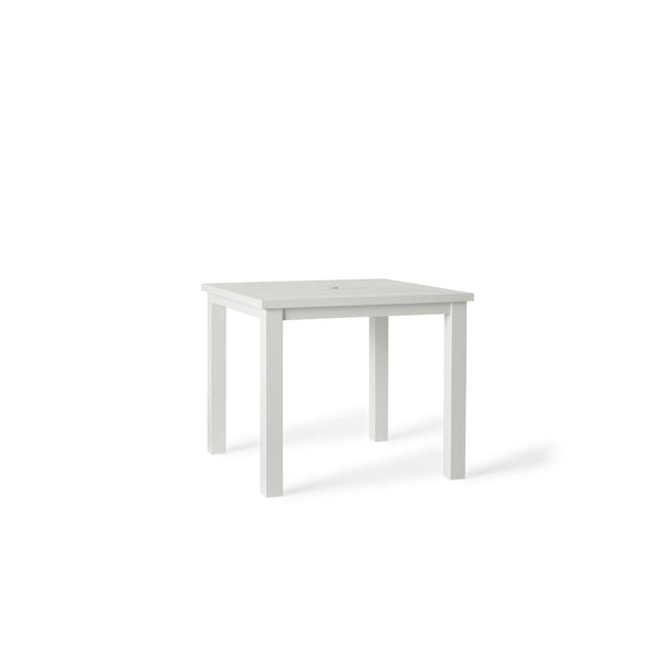 Belvedere Square Dining Table by Terra Outdoor Living in White, shown with a slatted aluminum top and central umbrella hole, featuring a clean-lined, modern silhouette in a compact size for versatile outdoor placement.