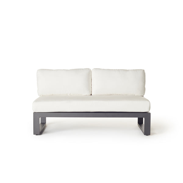 Belvedere Sectional Armless Loveseat by Terra Outdoor Living, shown in Charcoal aluminum with plush cushions, featuring a low-profile teak frame and deep seating for relaxed outdoor lounging. Armless design allows for modular configurations with the Belvedere Sectional pieces.
