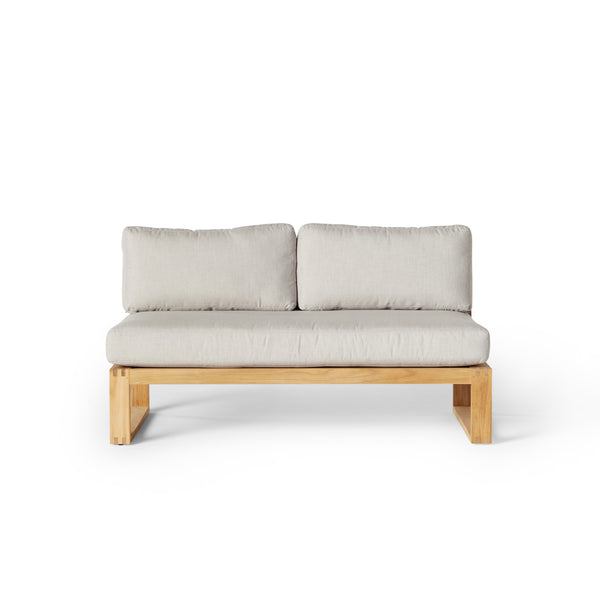 Belvedere Sectional Armless Loveseat by Terra Outdoor Living, shown in premium Teak with plush cushions, featuring a low-profile teak frame and deep seating for relaxed outdoor lounging. Armless design allows for modular configurations with the Belvedere Sectional pieces.
