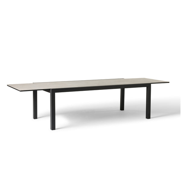 Del Mar Dining Table by Terra Outdoor Living — features an aluminum frame in 'Charcoal' with a ceramic top; seats up to 12 comfortably and includes a convenient extendable leaf that nests under the table when not in use, perfect for dining and entertaining. 