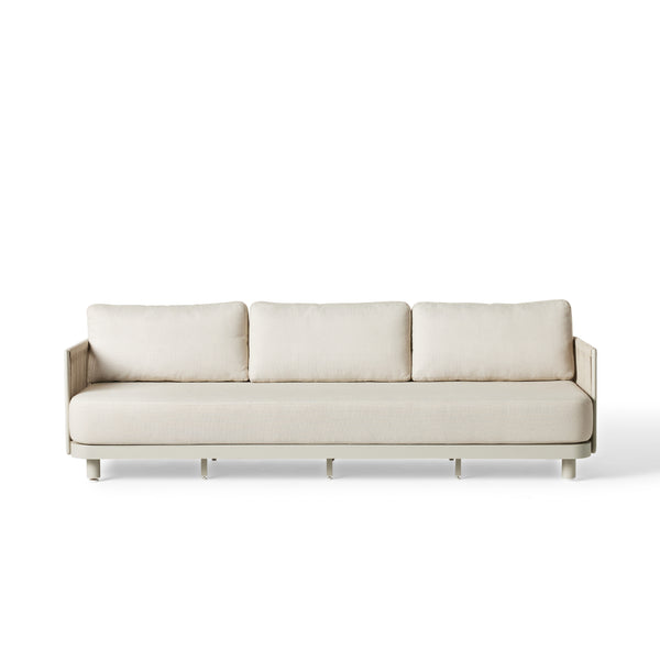 Seaside Sofa by Terra Outdoor Living — crafted with a sturdy aluminum frame and Italian polyolefin rope seat back, featuring strong lines and subtle organic curves; includes one long seat cushion and three back cushions in weather-friendly fabric, offering low-profile, comfortable seating for both relaxation and entertaining.
