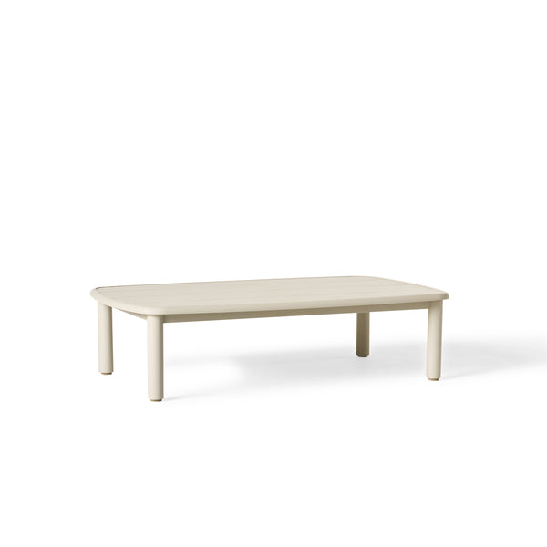 Stinson Coffee Table with durable powdercoated aluminum frame in 'Dune' finish - A light neutral hue. Featuring softly curved edges and vertical slat detailing; slatted tabletop offers ample space for drinks and snacks and allows water to drain.