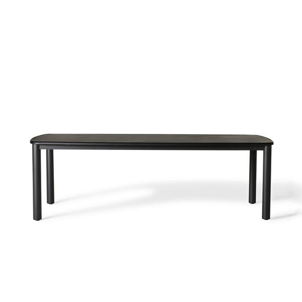 Stinson Dining Table in Aluminum by Terra Outdoor Living — crafted with a powdercoated aluminum frame in a charcoal finish, featuring a spacious slatted top that allows water to drain; comfortably seats up to 8 people, ideal for pairing with Stinson Dining Chairs or any of our dining chairs.