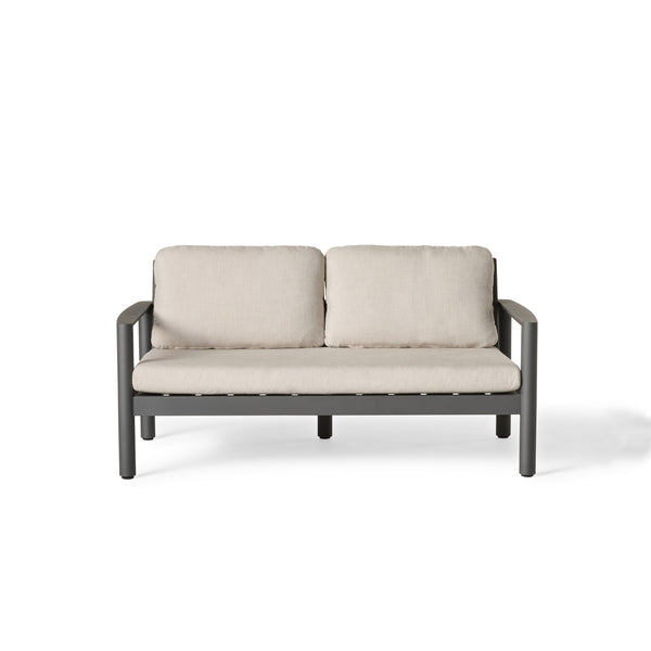 Stinson Loveseat in Charcoal Aluminum by Terra Outdoor Living — features a powdercoated aluminum frame with Italian rope seat back, curved lines, and vertical slats for a wraparound silhouette; includes one long seat cushion and two back cushions in weather-friendly fabric for outdoor comfort and durability.