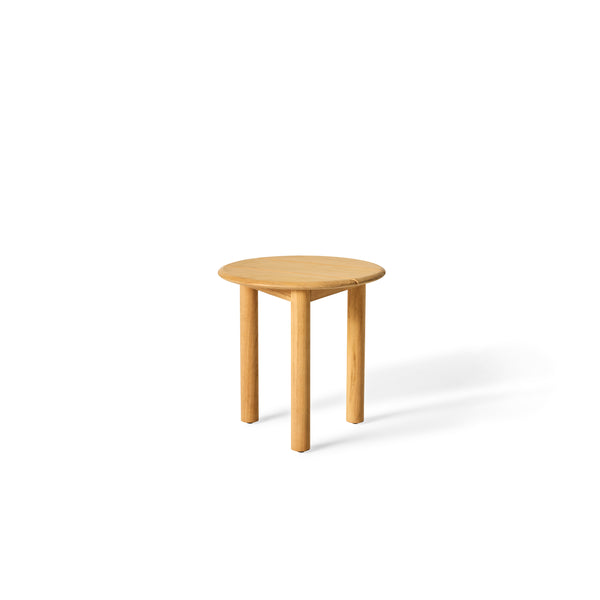 Stinson Side Table by Terra Outdoor Living. Made of premium teak in a natural finish, with curved edges. Compact slatted top provides space for a drink or book and allows water to drain, perfect alongside outdoor seating.
